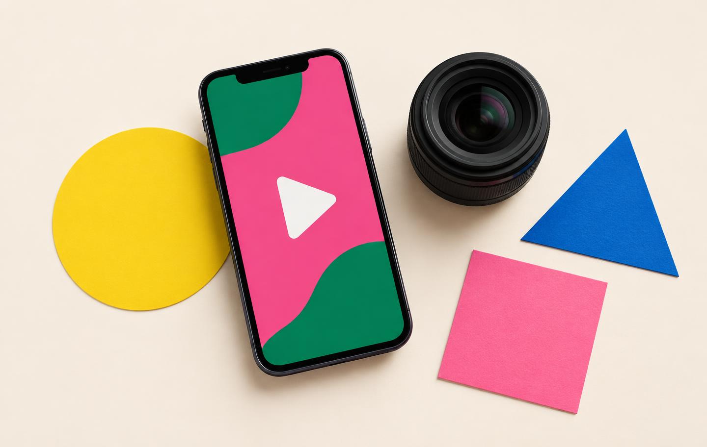 Content creation artwork: a phone, camera lens and colourful geometric shapes